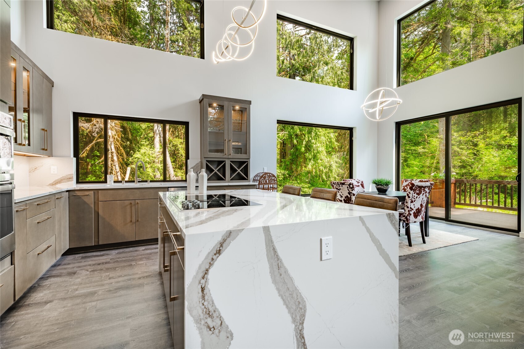 12031 Shuksan Rim Drive Deming, WA 98244 - Photo 10 of 39 a kitchen with a stove a sink and a refrigerator