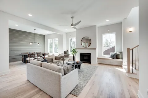 a living room with furniture a fireplace and a fireplace