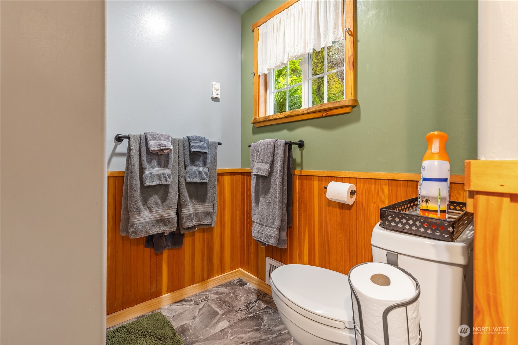 51917 South Riverside Road Gold Bar, WA 98251 - Photo 14 of 19 a bathroom with a toilet a sink and a mirror