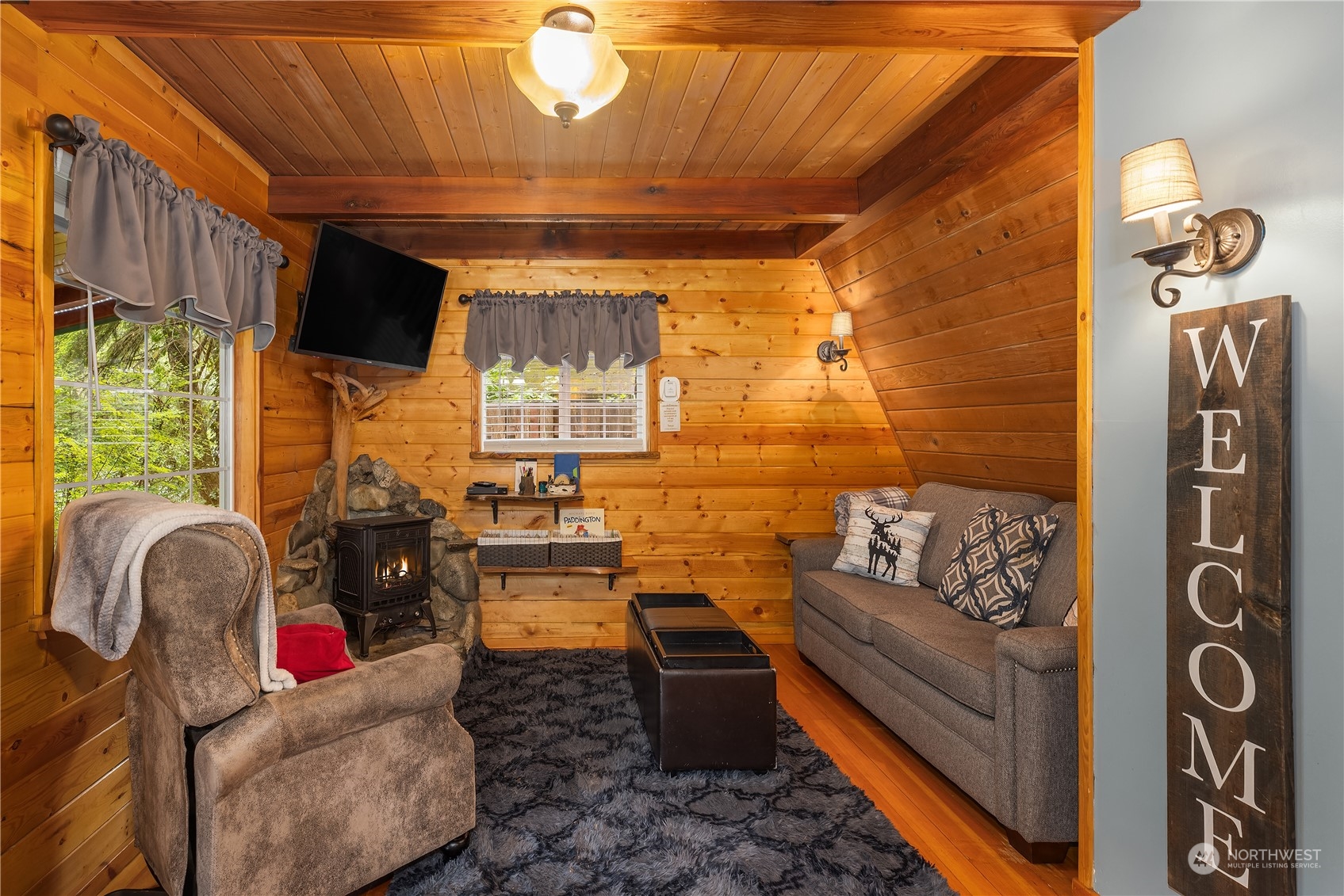 51917 South Riverside Road Gold Bar, WA 98251 - Photo 8 of 19 a living room with furniture and a flat screen tv