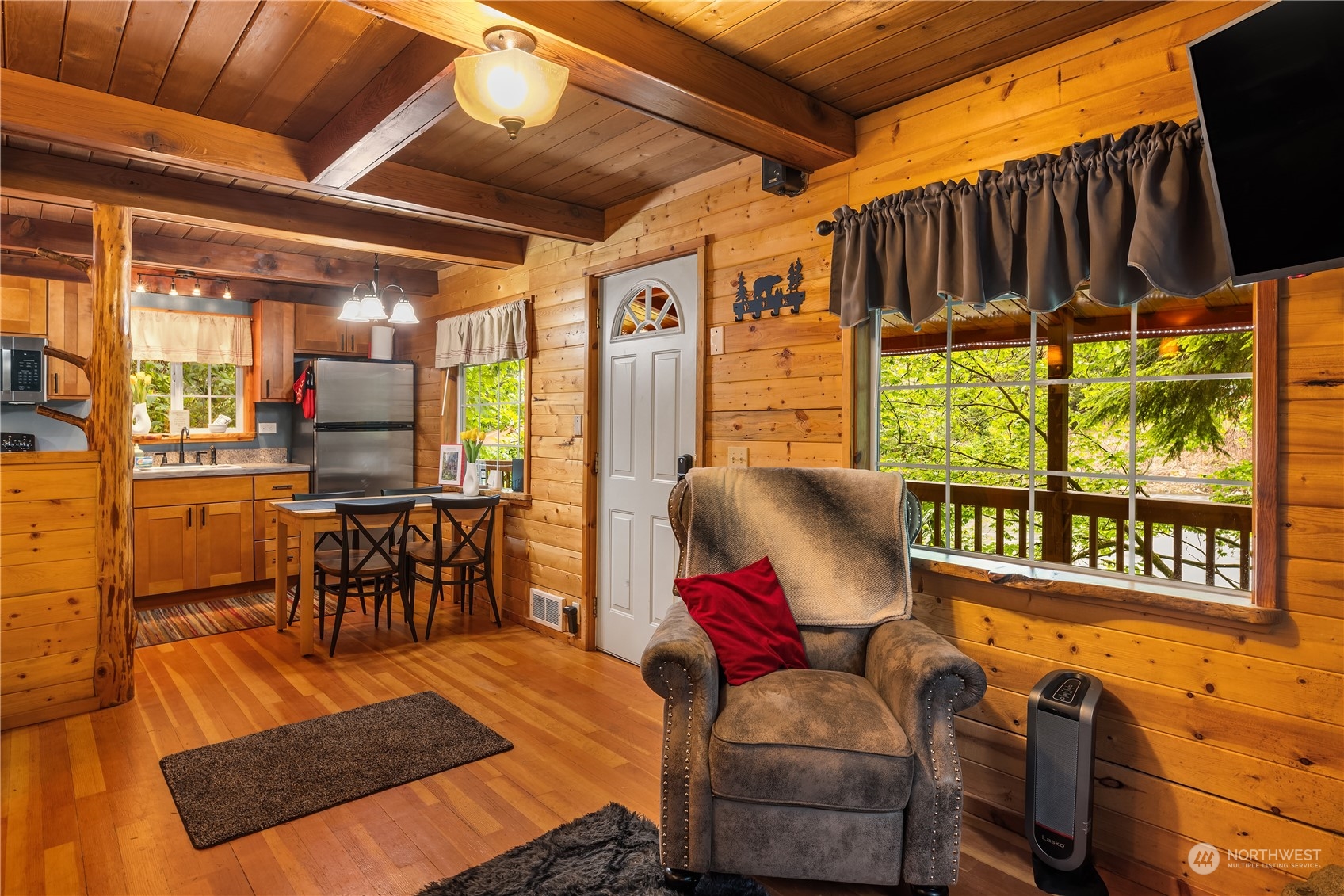 51917 South Riverside Road Gold Bar, WA 98251 - Photo 9 of 19 a living room with furniture ceiling fan and a rug