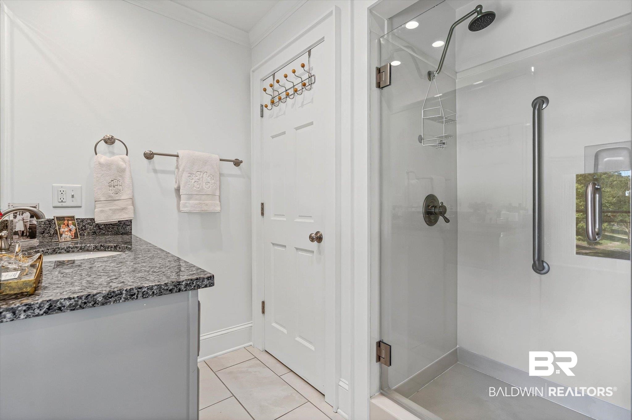 513 Spring Park Drive East Mobile, AL 36608 - Photo 24 of 44 Full bathroom featuring a shower stall, light tile patterned floors, vanity, and ornamental molding
