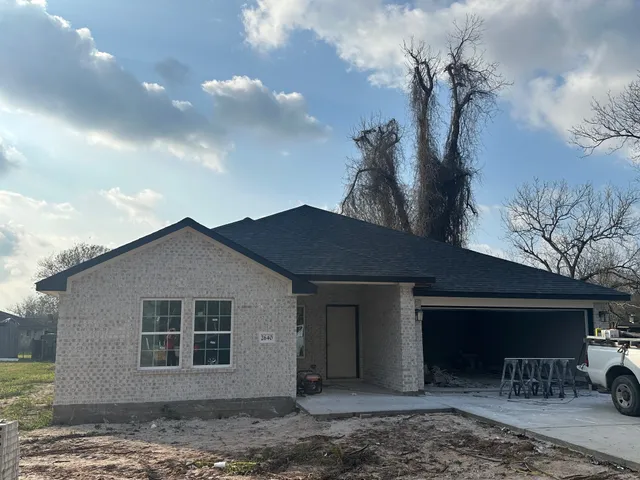 a house view with a backyard space