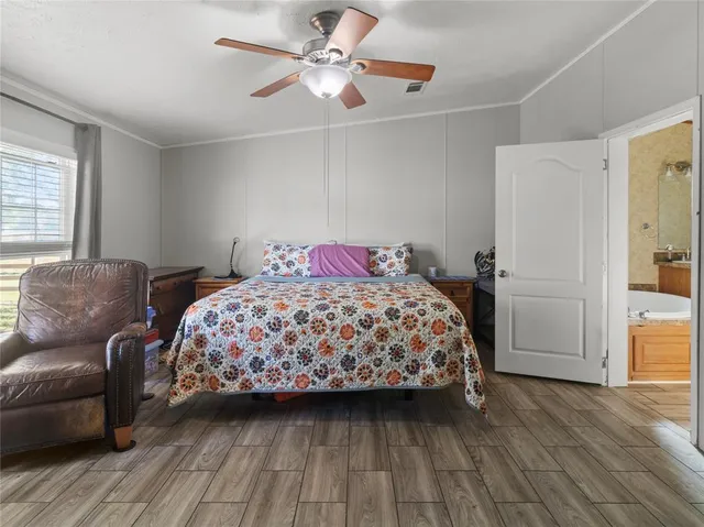 a bedroom with a large bed and a couch