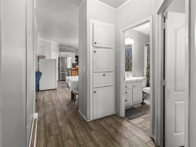 a view of a walk in closet and bathroom