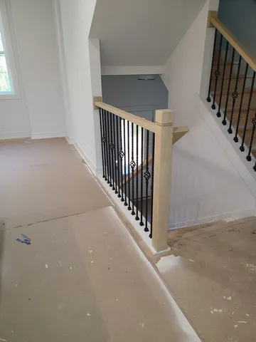 a bathroom with a granite countertop sink a toilet and a mirror