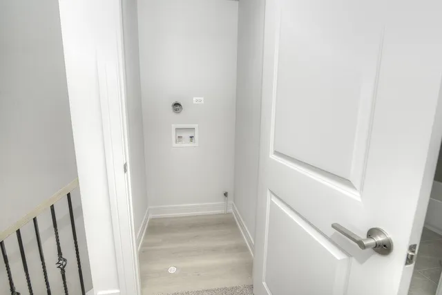 a view of staircase with white walls