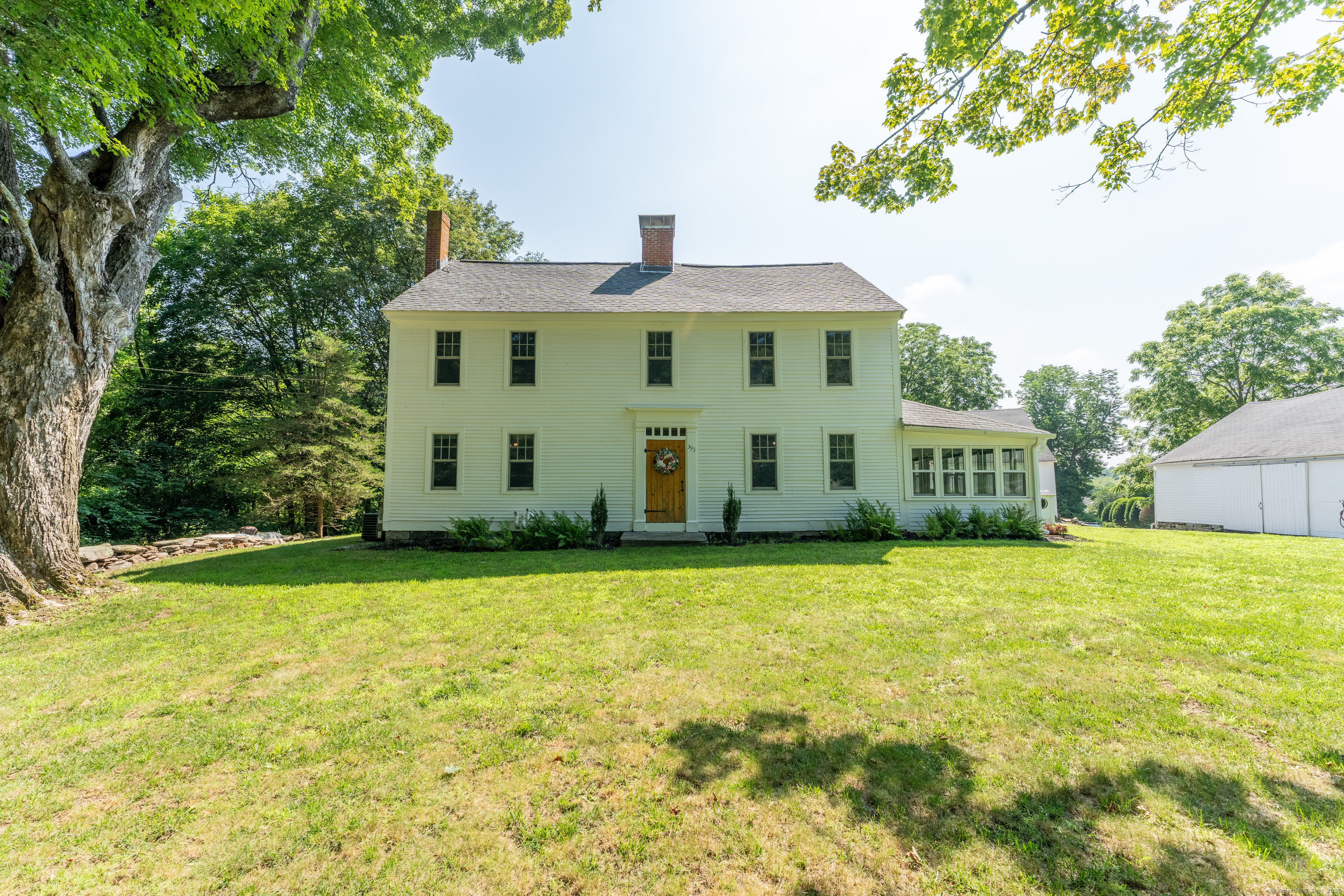 393 North Canterbury Road Canterbury, CT 06331 - Photo 2 of 40 a front view of a house with a yard