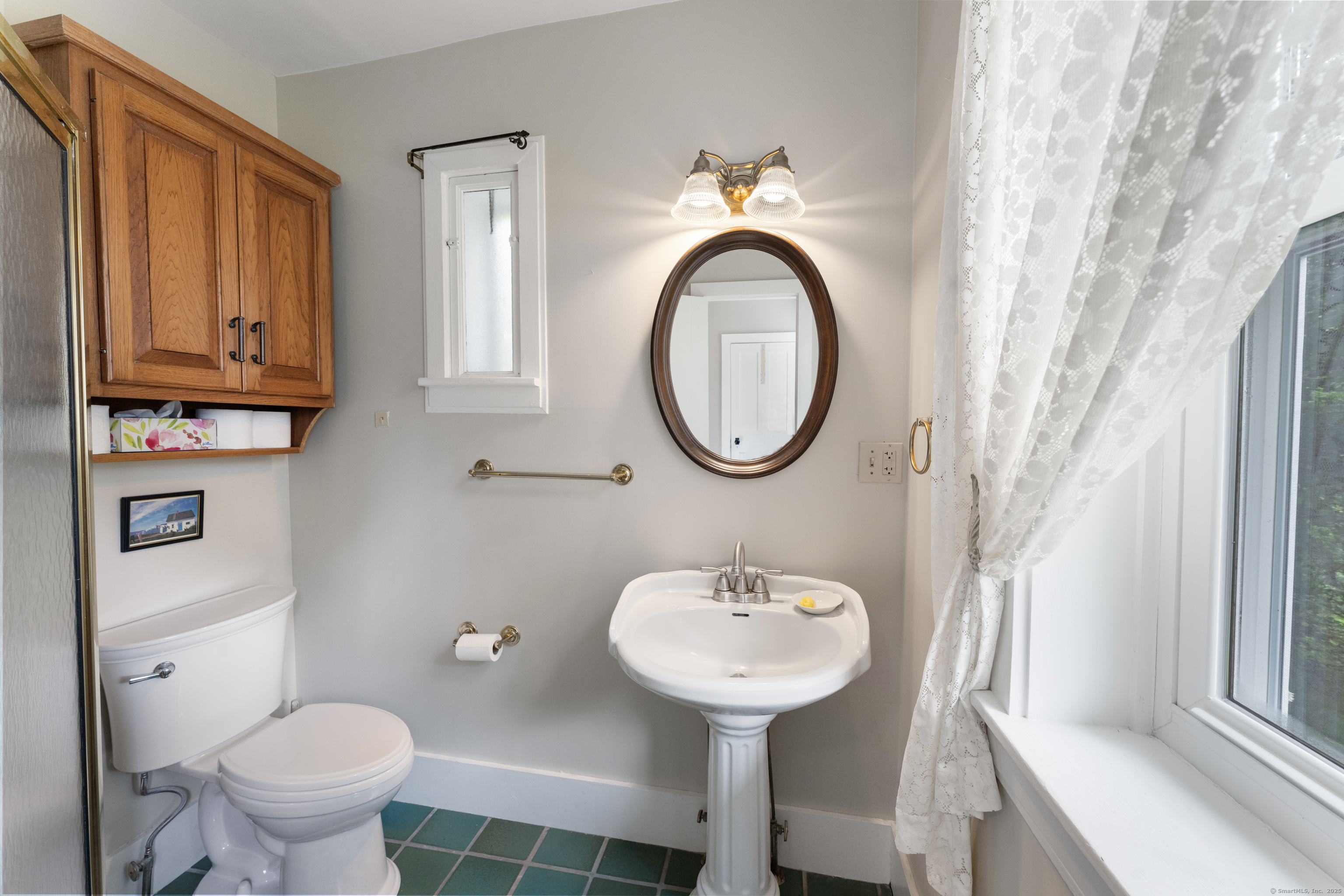 393 North Canterbury Road Canterbury, CT 06331 - Photo 22 of 40 a bathroom with a toilet sink and mirror