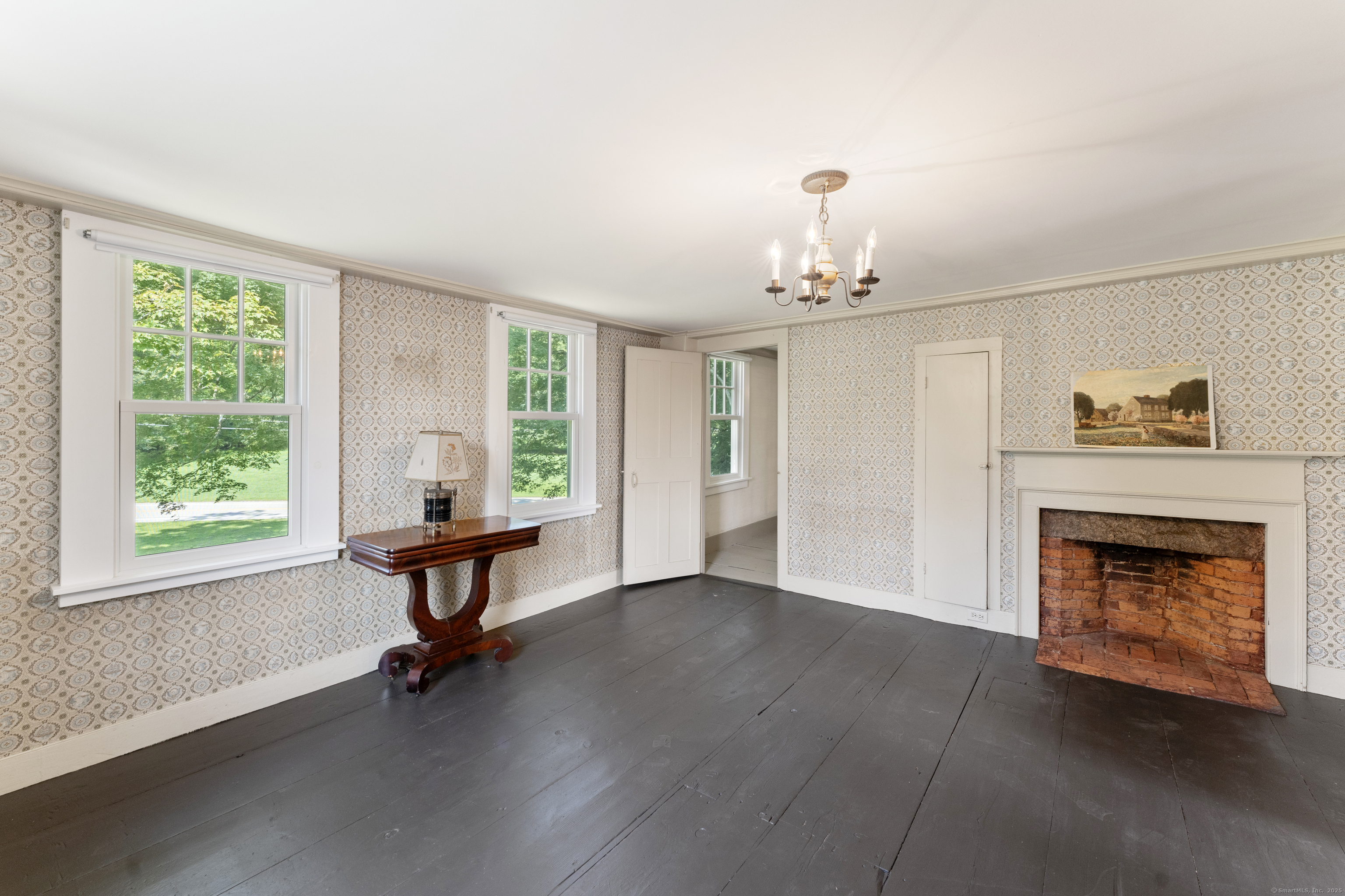 393 North Canterbury Road Canterbury, CT 06331 - Photo 26 of 40 a living room with furniture and a fireplace