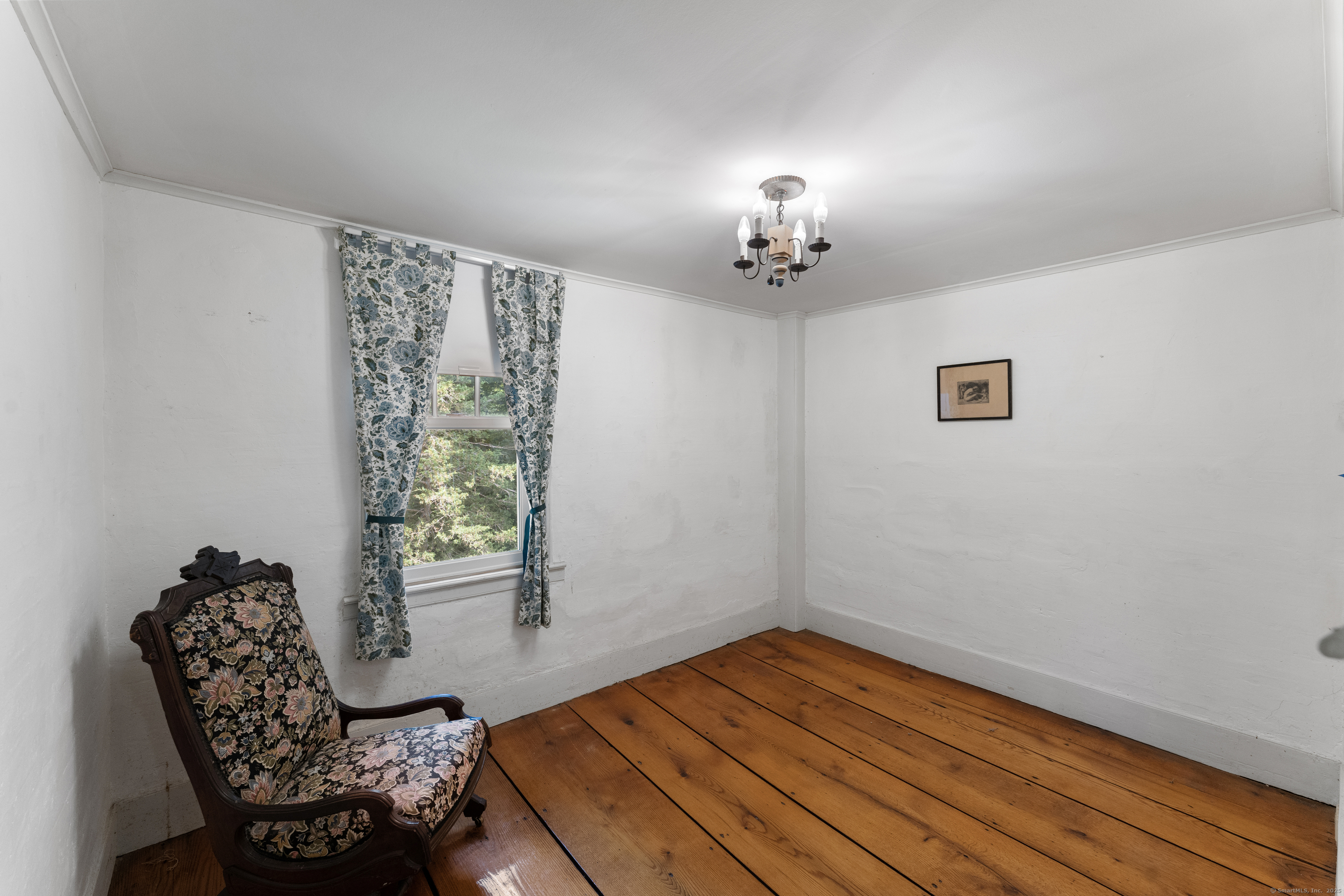 393 North Canterbury Road Canterbury, CT 06331 - Photo 29 of 40 a view of a room with wooden floor lounge chair and windows