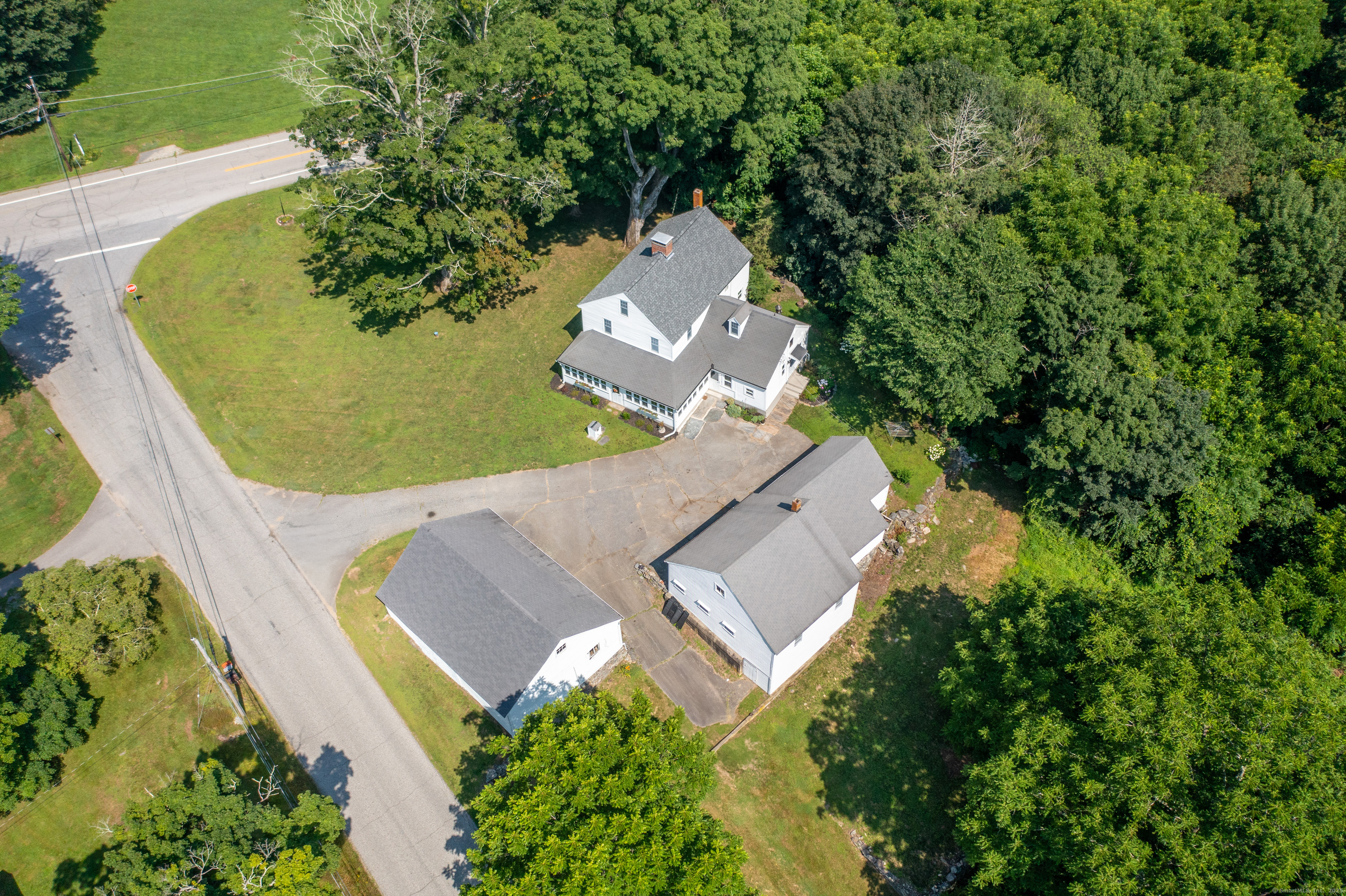 393 North Canterbury Road Canterbury, CT 06331 - Photo 35 of 40 an aerial view of a house with a swimming pool