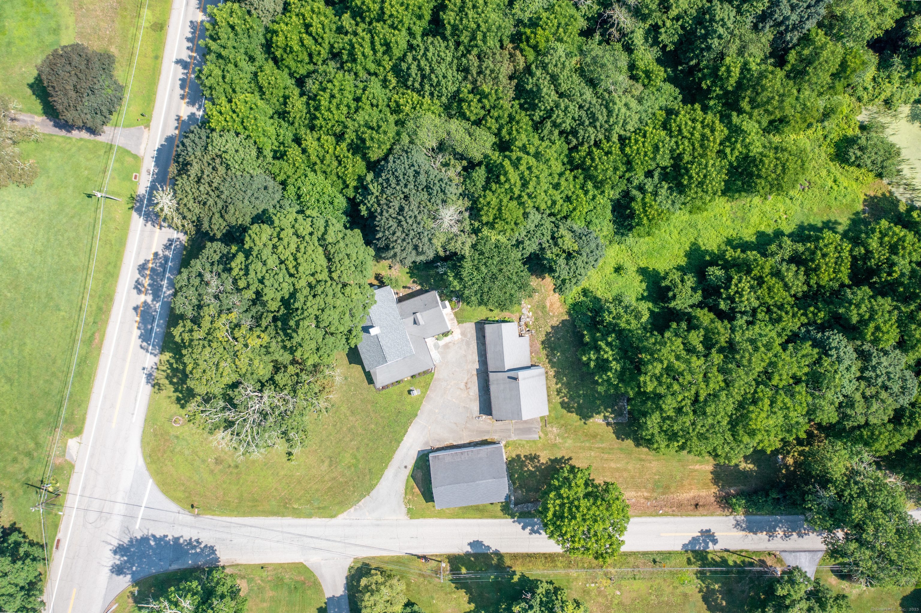 393 North Canterbury Road Canterbury, CT 06331 - Photo 36 of 40 an aerial view of a house with a swimming pool
