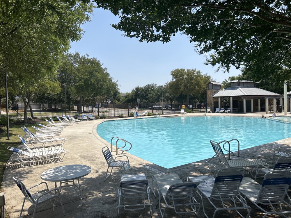 a view of a swimming pool with a patio