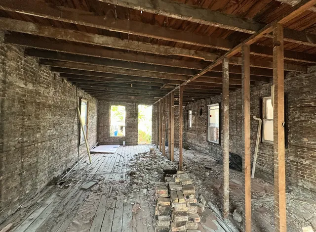 a view of a room with wooden walls
