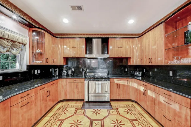 a white bath tub sitting in a bathroom next to a window