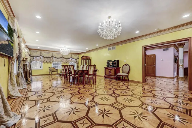 a bathroom with a granite countertop toilet sink and mirror