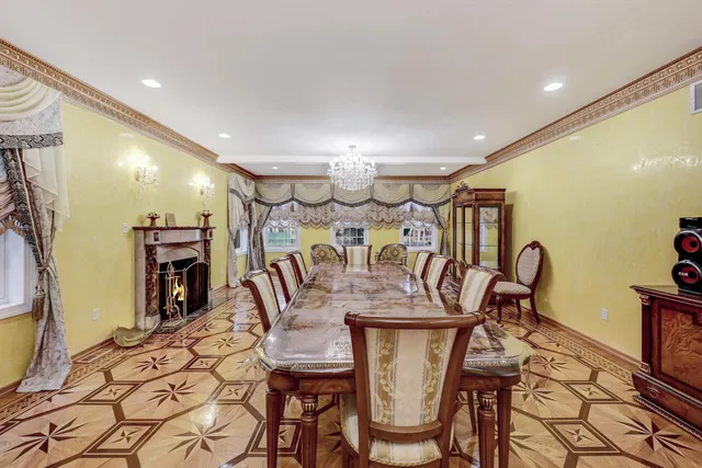 a view of a house with a large window and wooden fence
