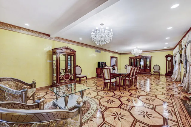 a bedroom with a bed and a dresser with mirror