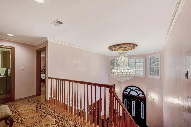 a bathroom with a sink a toilet a mirror and shower
