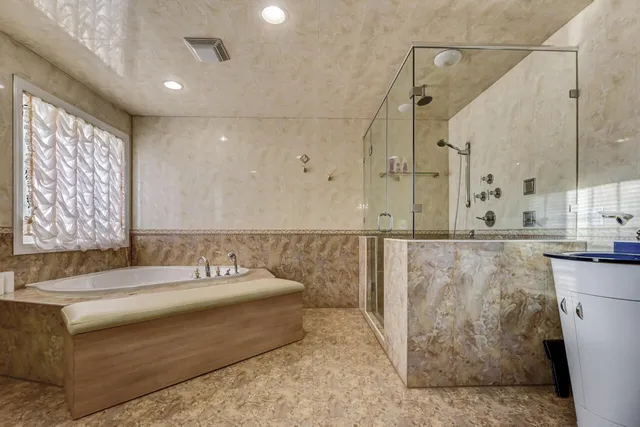 a view of a patio with table and chairs with wooden floor and fence
