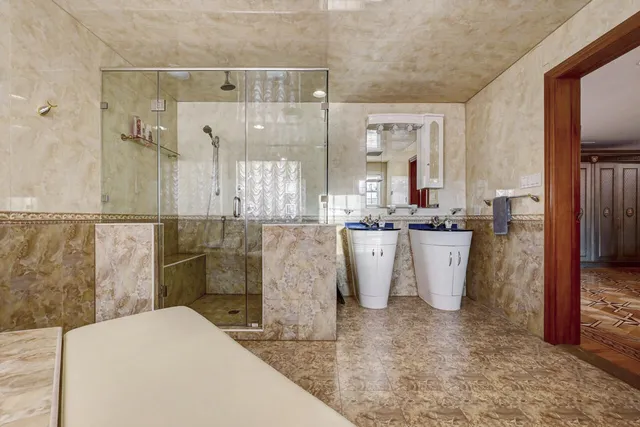 a view of a balcony with table and chairs