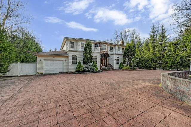 a living room with furniture a flat screen tv and a large window