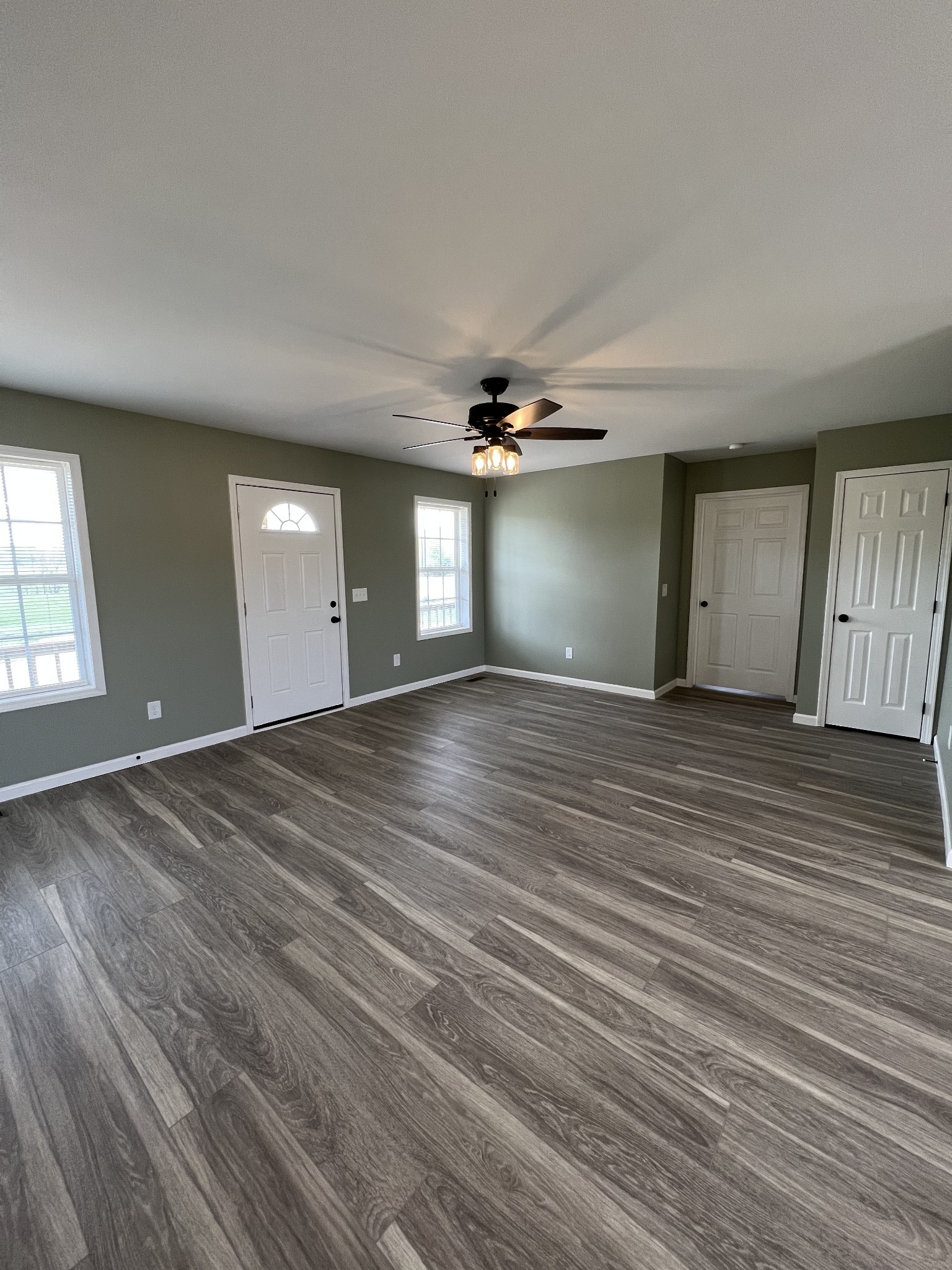 2363 Willette Road Red Boiling Springs, TN 37150 - Photo 3 of 10 wooden floor in an empty room with a window