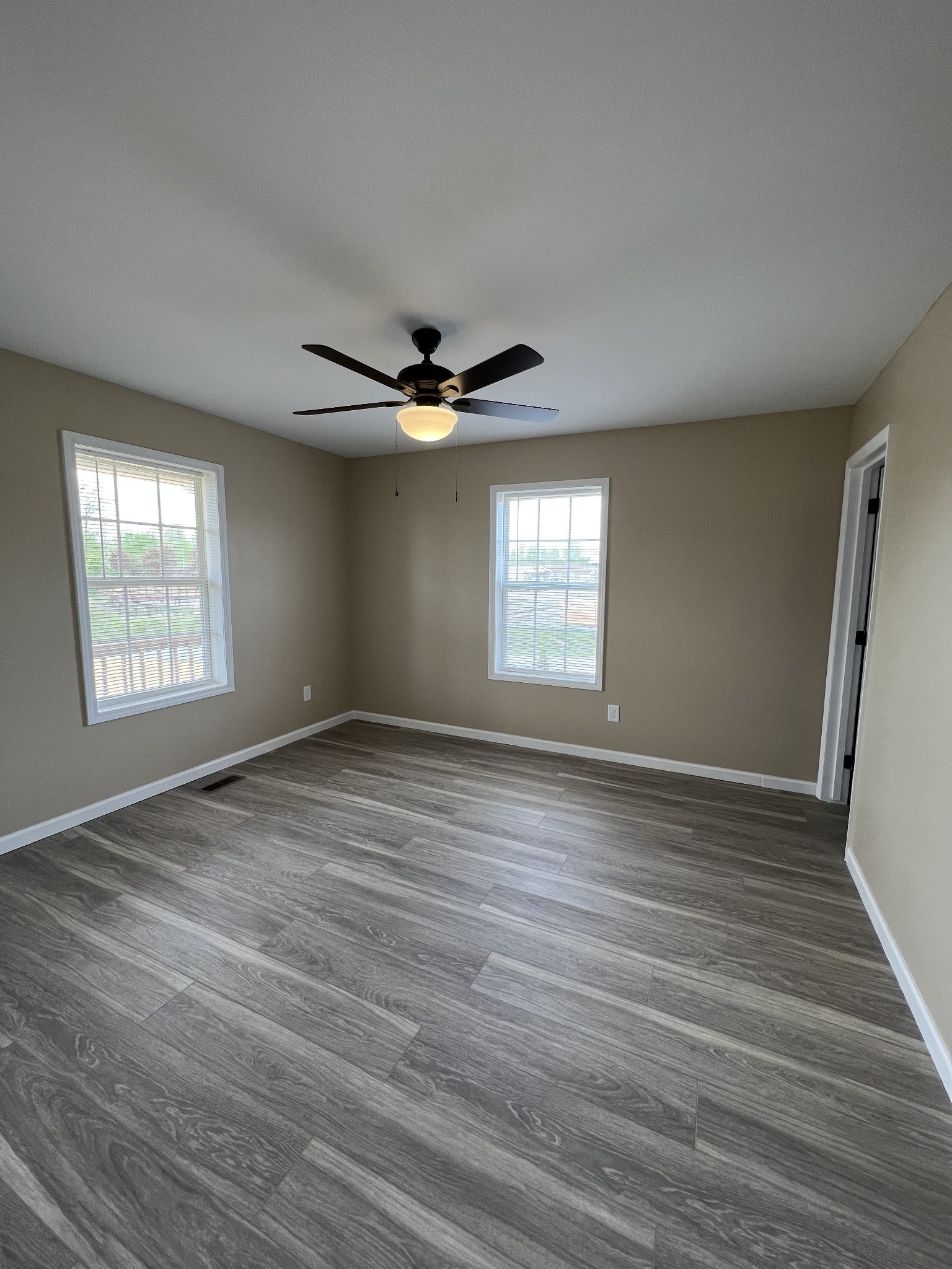 2363 Willette Road Red Boiling Springs, TN 37150 - Photo 5 of 10 an empty room with wooden floor and windows