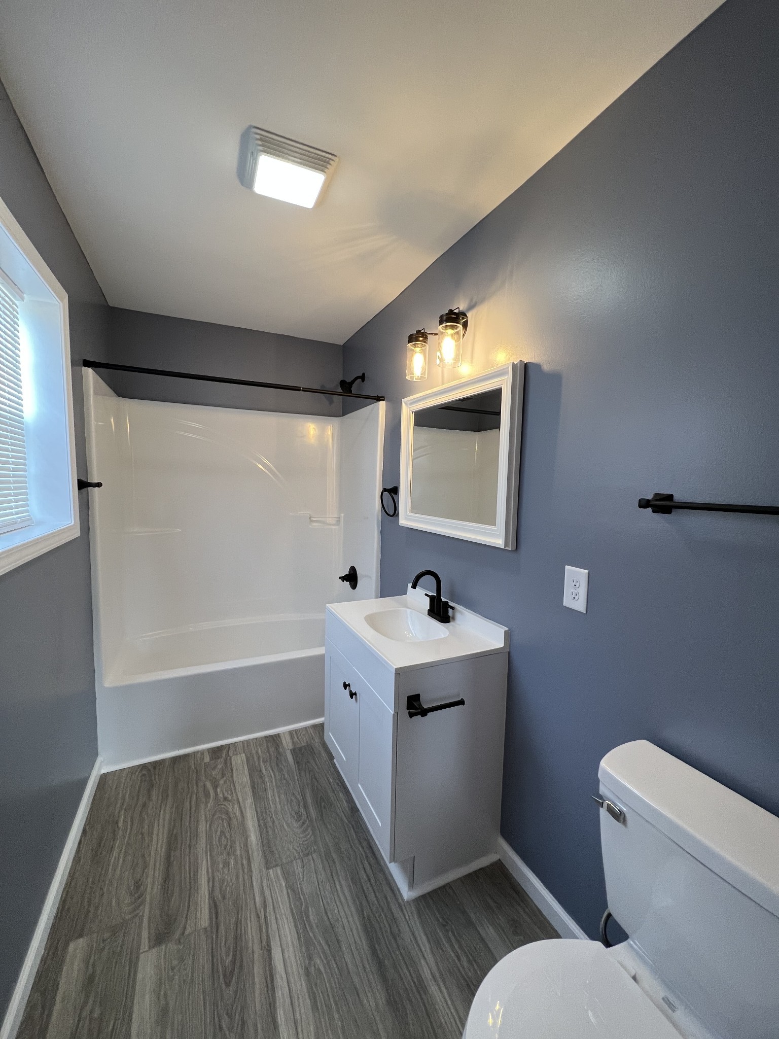 2363 Willette Road Red Boiling Springs, TN 37150 - Photo 6 of 10 a bathroom with a toilet sink and mirror