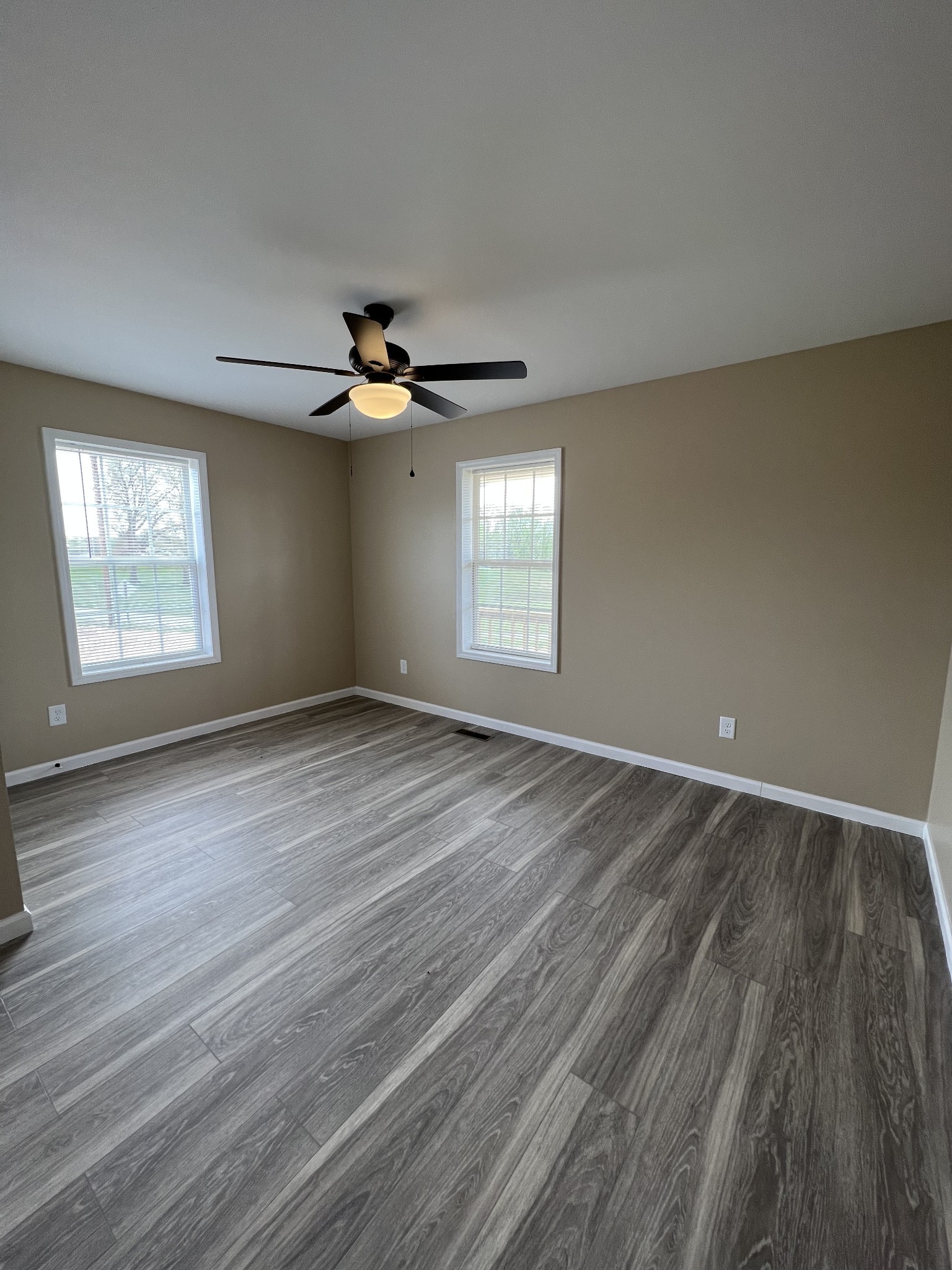 2363 Willette Road Red Boiling Springs, TN 37150 - Photo 7 of 10 wooden floor in an empty room with a window
