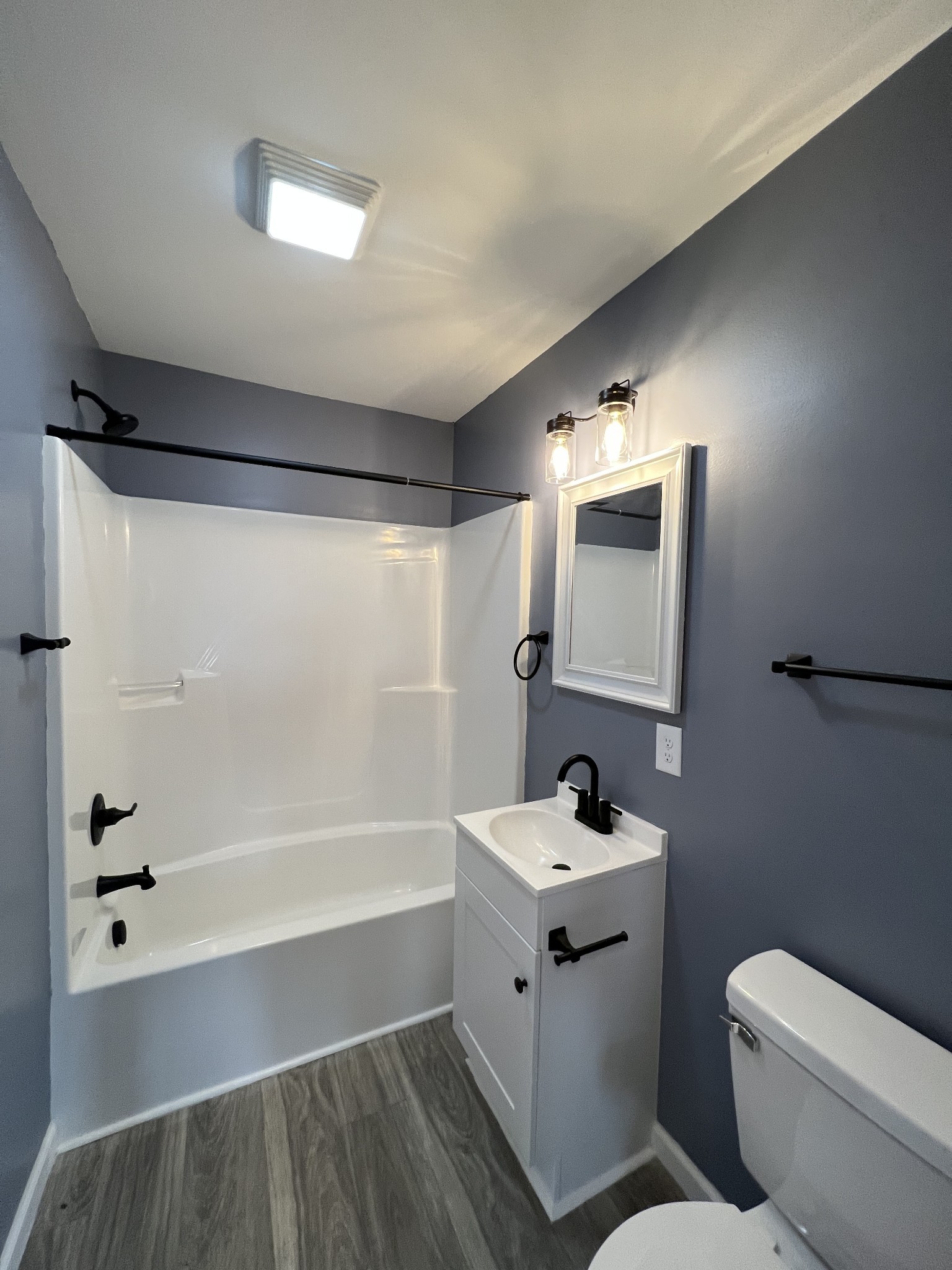 2363 Willette Road Red Boiling Springs, TN 37150 - Photo 8 of 10 a bathroom with a sink toilet a mirror and shower