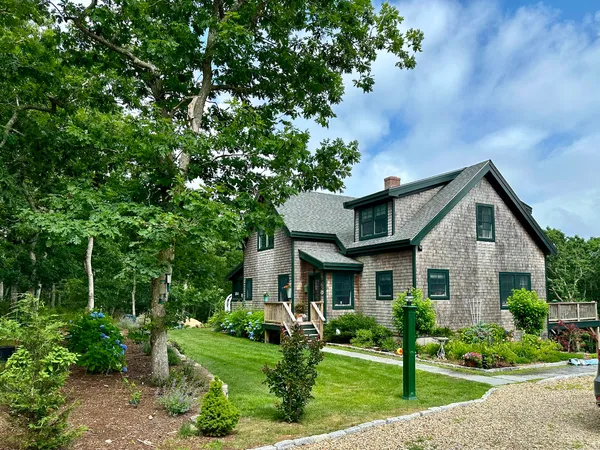 a front view of a house with garden