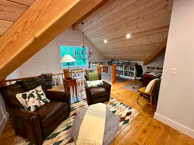 a outdoor living space with furniture and a fireplace