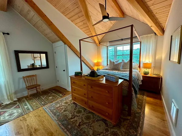 a room with wooden floor and chair