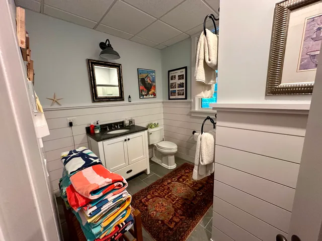 a backyard of a house with lots of green space and fountain