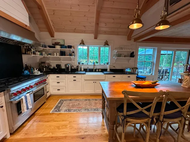 a kitchen with stainless steel appliances granite countertop a stove and a refrigerator