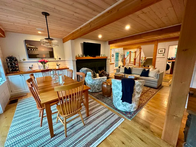 a living room with furniture flat screen tv and a fireplace