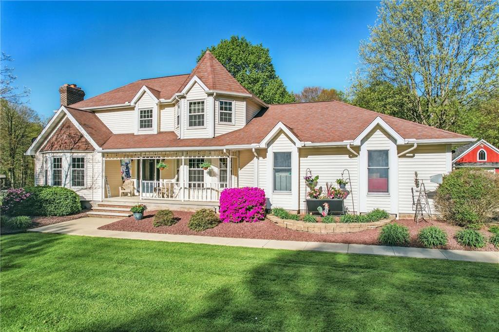 9935 Greiser Road Conneaut Lake, PA 16316 - Photo 1 of 50 a front view of house with yard and green space