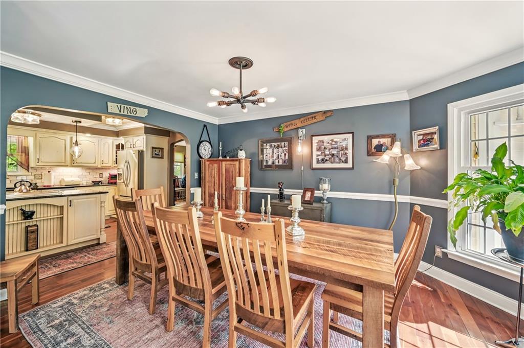 9935 Greiser Road Conneaut Lake, PA 16316 - Photo 19 of 50 a view of a dining room with furniture and wooden floor