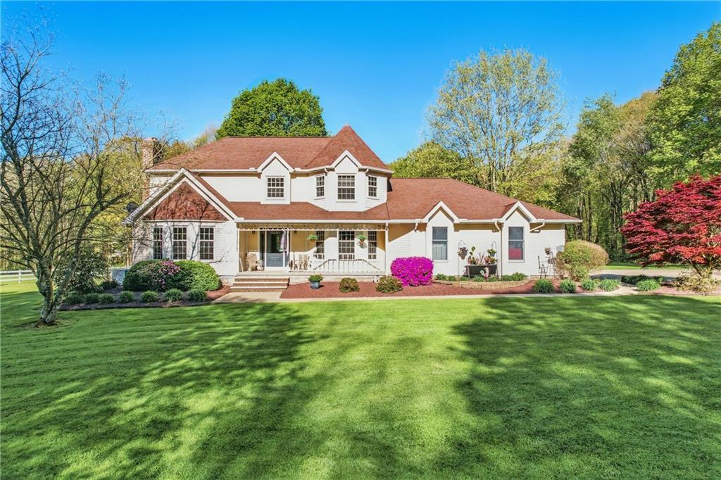 9935 Greiser Road Conneaut Lake, PA 16316 - Photo 2 of 50 a front view of house with yard and garage