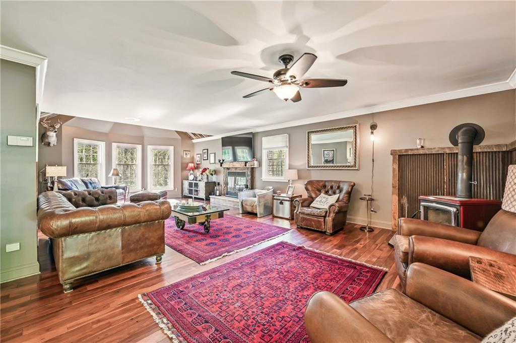9935 Greiser Road Conneaut Lake, PA 16316 - Photo 29 of 50 a living room with furniture ceiling fan and a rug