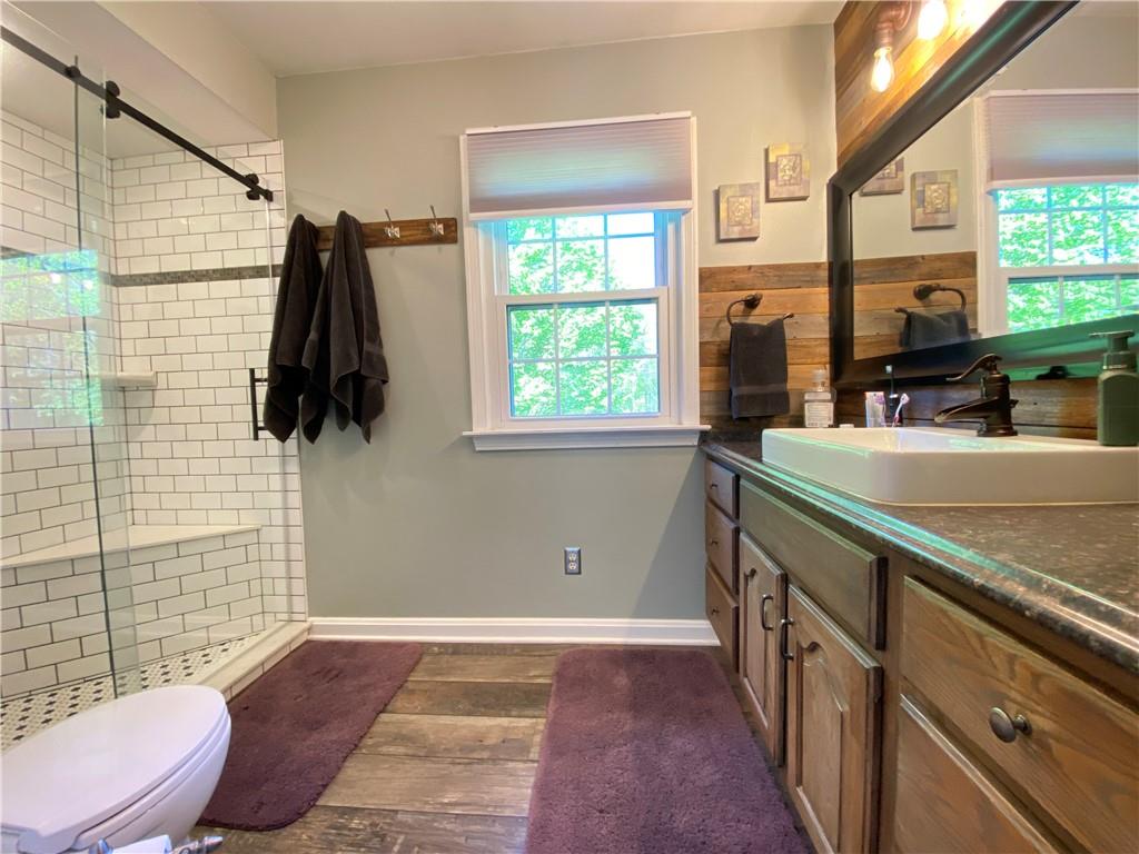 9935 Greiser Road Conneaut Lake, PA 16316 - Photo 33 of 50 a bathroom with a sink a toilet and shower