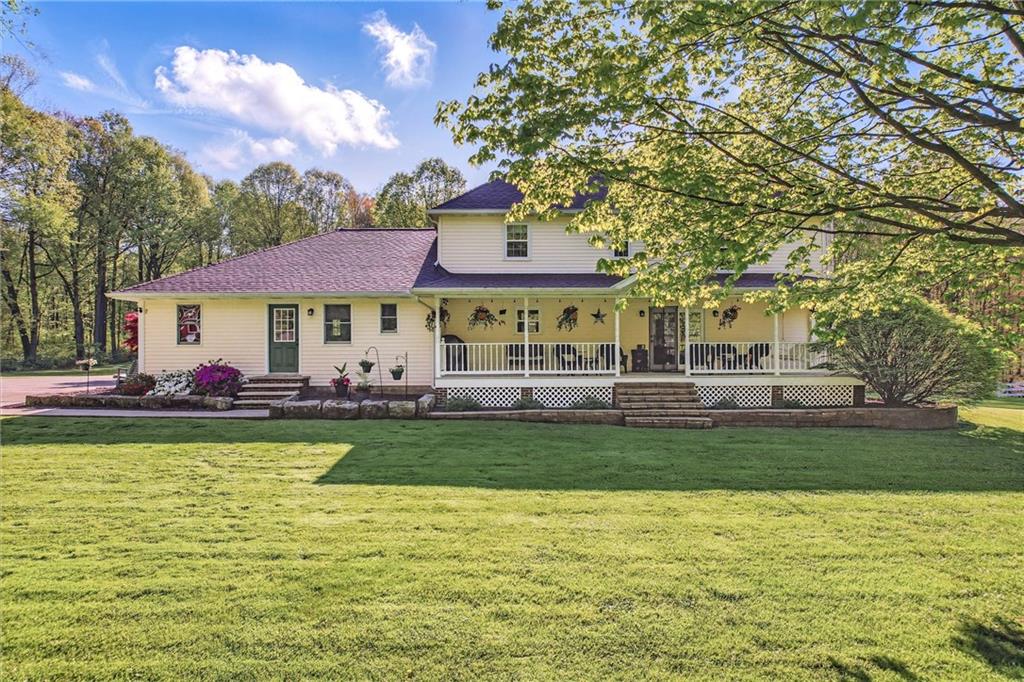 9935 Greiser Road Conneaut Lake, PA 16316 - Photo 6 of 50 a view of a swimming pool with lawn chairs and plants