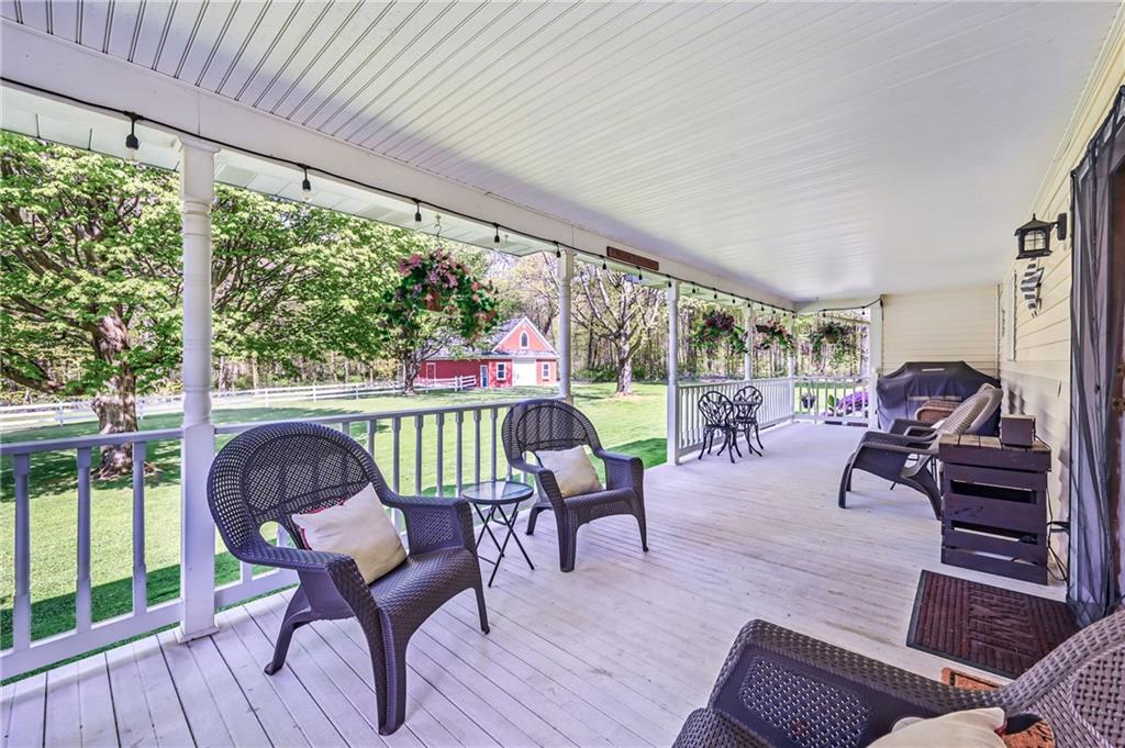 9935 Greiser Road Conneaut Lake, PA 16316 - Photo 7 of 50 a living room with furniture and a large window