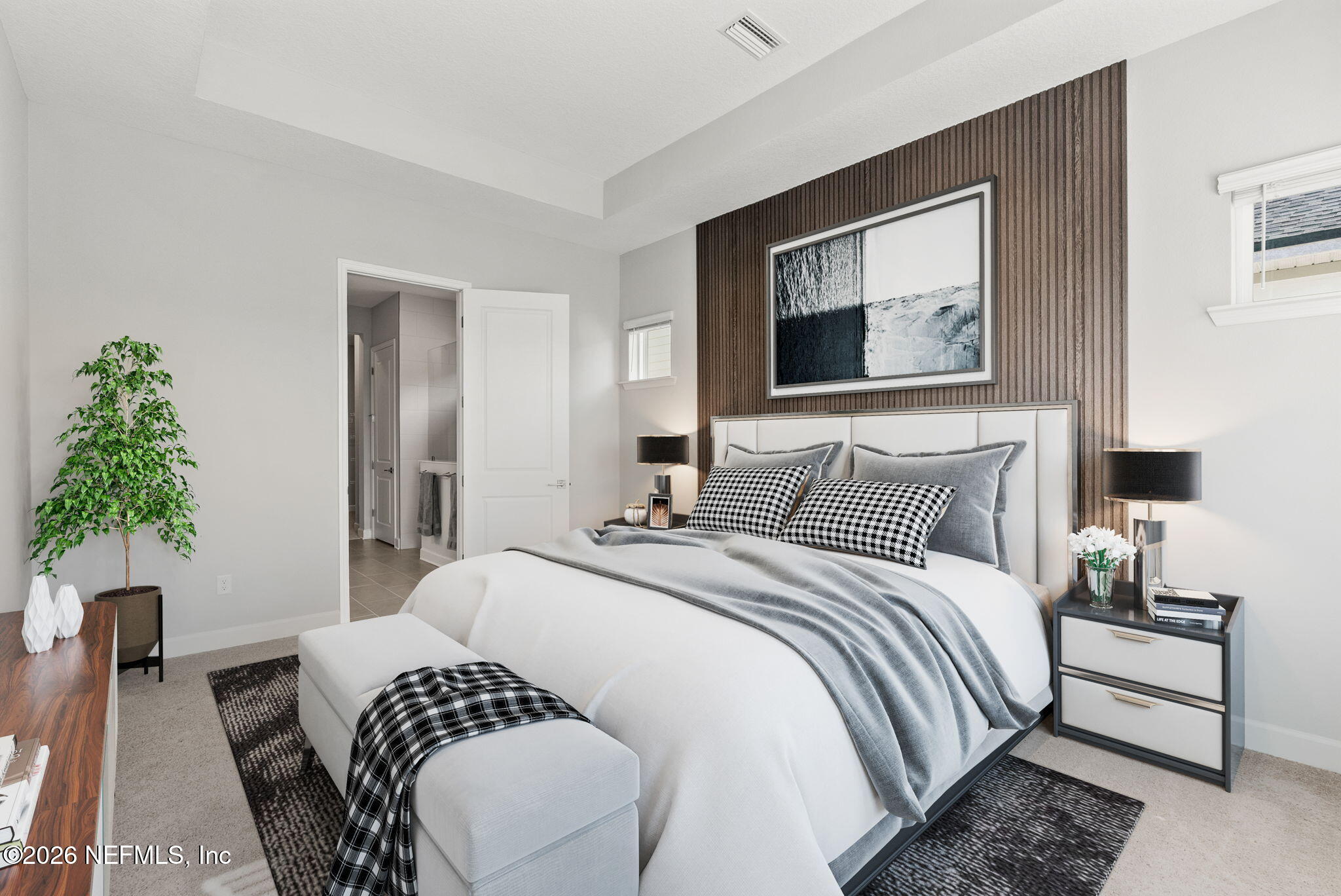 11465 Catalyst Road Jacksonville, FL 32256 - Photo 17 of 61 a bedroom with bed and a potted plant