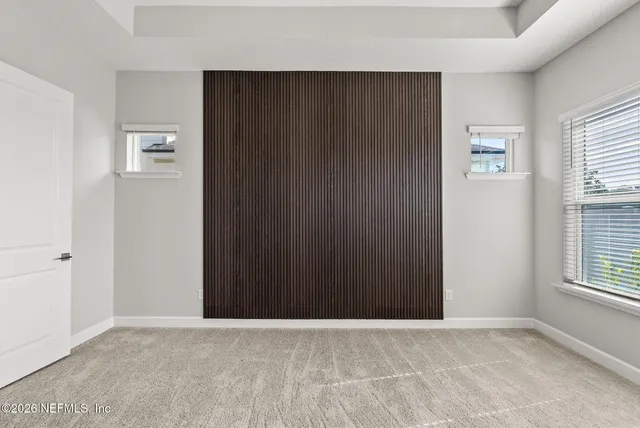 a view of swimming pool with outdoor seating and lake view