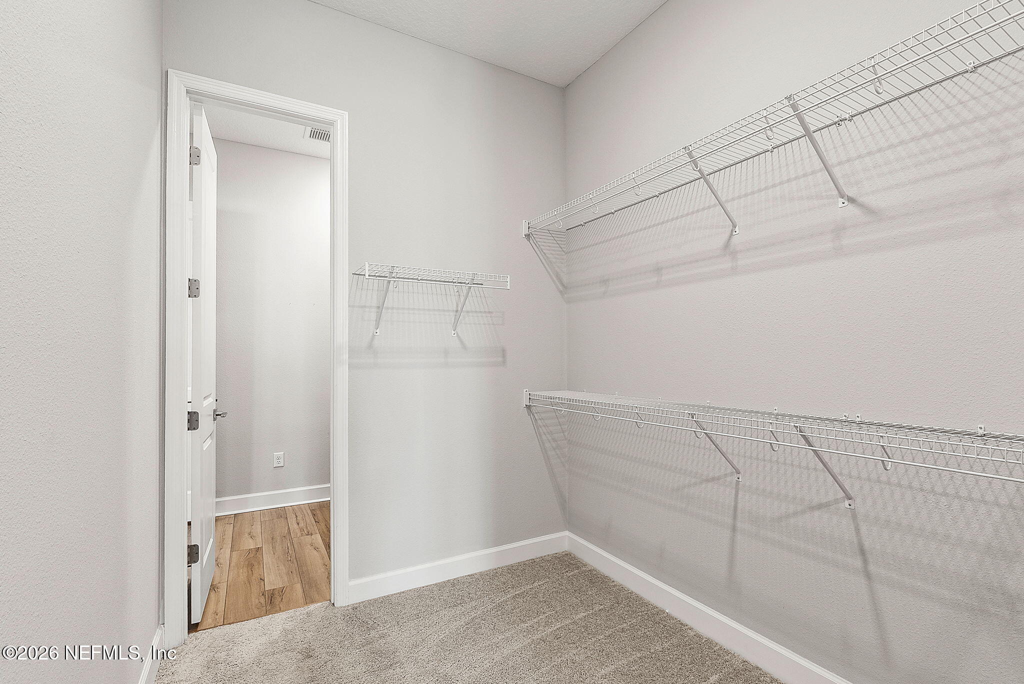 11465 Catalyst Road Jacksonville, FL 32256 - Photo 28 of 61 a view of a room with racks on the wall