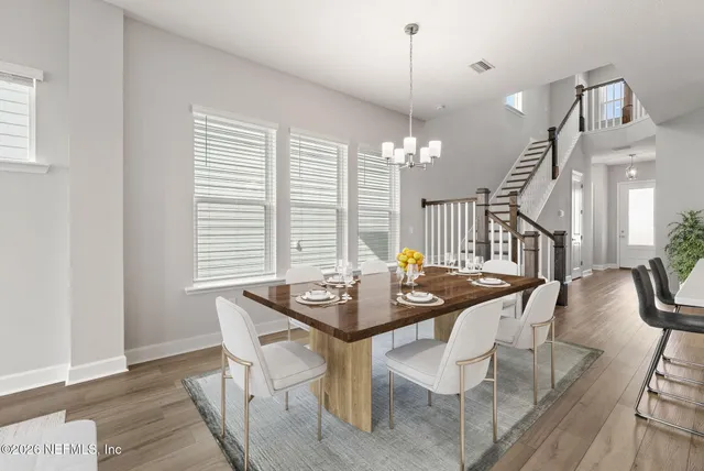 a kitchen with stainless steel appliances granite countertop a sink a stove and a microwave