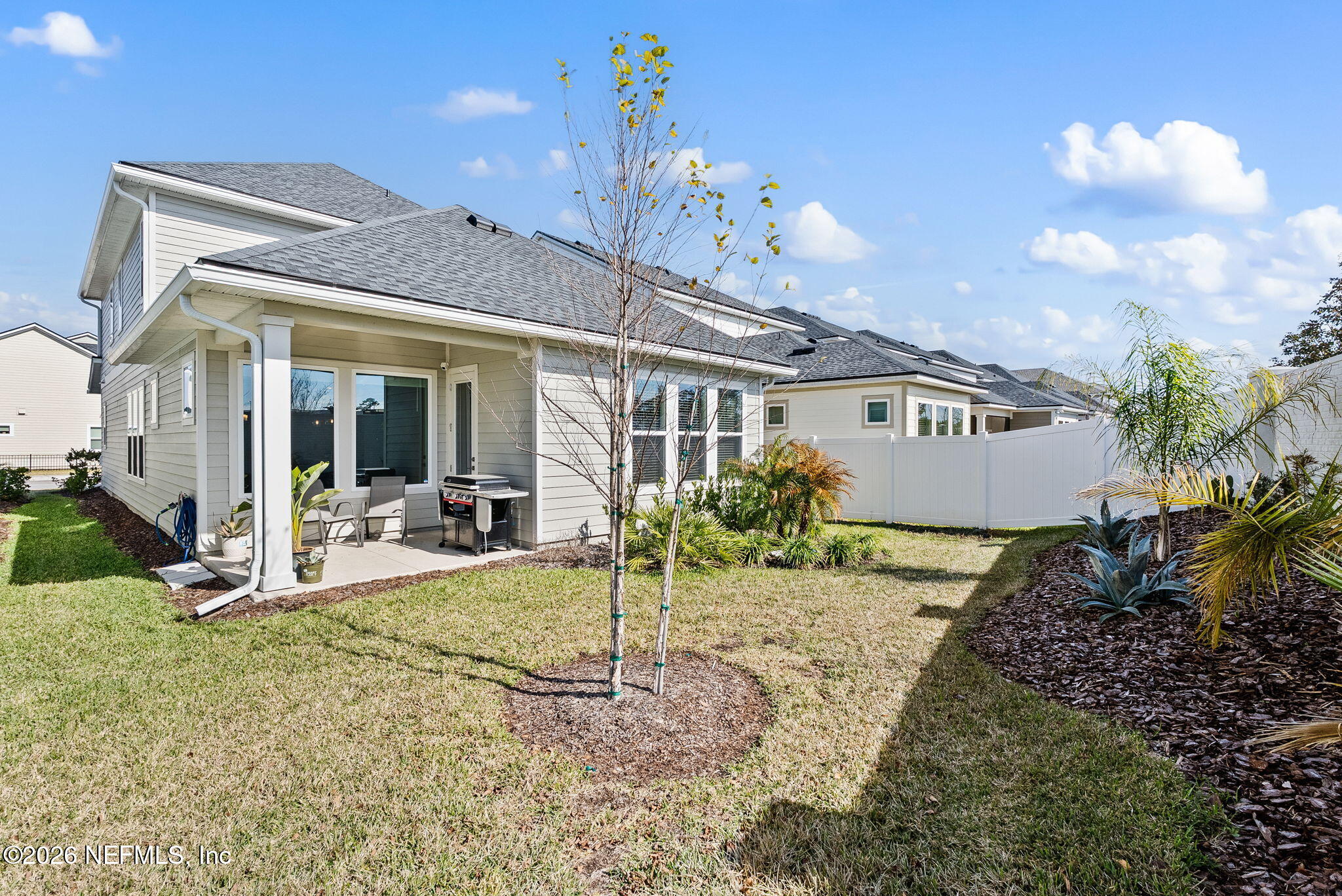 11465 Catalyst Road Jacksonville, FL 32256 - Photo 42 of 61 a view of a house with backyard and sitting area